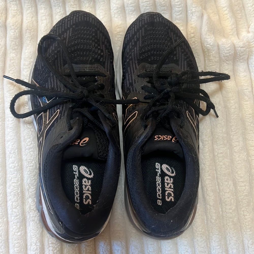 ASICS running shoe. Size 7.5 women’s. Black with gold rose and grey detail.